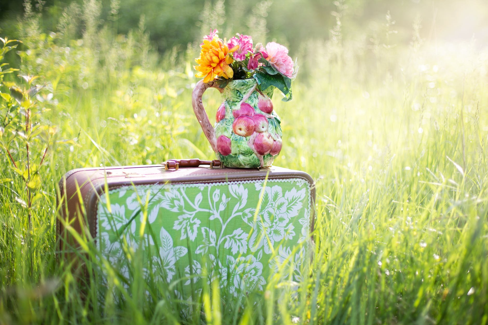 red and green floral suitcase